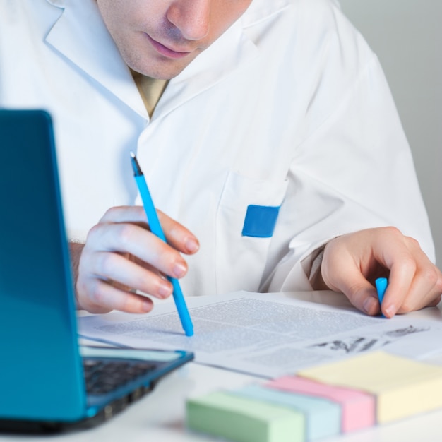 A close-up shot of a student working on a standardized test, emphasizing the materials, such as pencils and test booklets. The focus is on the test paper, highlighting the types of questions and answer formats being used. The lighting is soft, creating a contemplative atmosphere.