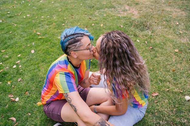 A transgender student being hugged by their parents in a supportive and loving embrace. The scene conveys acceptance and family support.