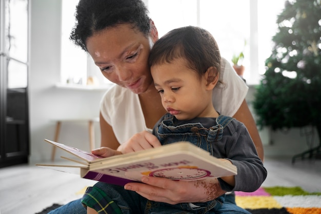 A parent and child reading a book together, emphasizing the importance of early literacy and parental involvement in a child's education. They are sitting comfortably in a cozy setting, creating a warm and inviting atmosphere.