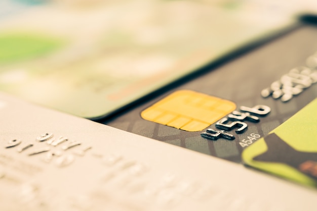 A close-up shot of a credit card statement highlighting the interest rate and the total amount of interest paid over a certain period. The image also shows a calculator and a pen, symbolizing financial calculation.