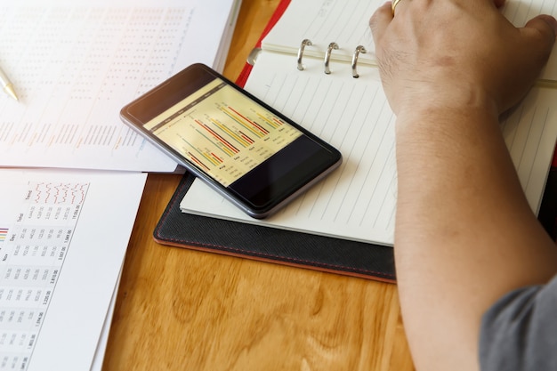 A visual representation of someone organizing their finances, using budgeting apps and spreadsheets, to understand their total credit card debt. The image should convey clarity and control.
