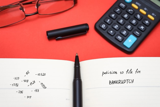 A close-up shot of a calculator displaying equations representing potential tax savings from 401(k) and IRA contributions. Coins and miniature retirement-themed figurines are scattered around the calculator, reinforcing the concept of tax-advantaged financial planning.