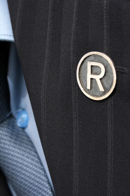 A close-up shot of a business professional reviewing a document with an IRS logo in the bottom corner, highlighting the importance of compliance.