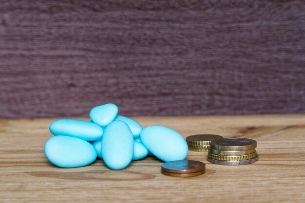 A close-up of stacked coins beside a prescription bottle, symbolizing healthcare savings.