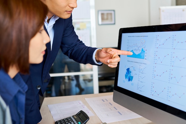 A computer screen displaying detailed charts and graphs comparing employee benefits packages across various companies in the same industry. The data includes health insurance, retirement plans, and paid time off policies.