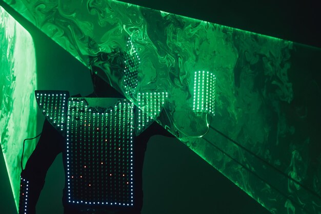 A digital rendering of a circuit board overlaid with stock market tickers, representing the integration of technology and finance and the increasing importance of tech investments.