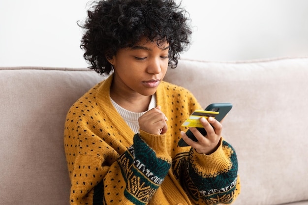 A person carefully considering a credit card application, highlighting the importance of thoughtful financial decisions.