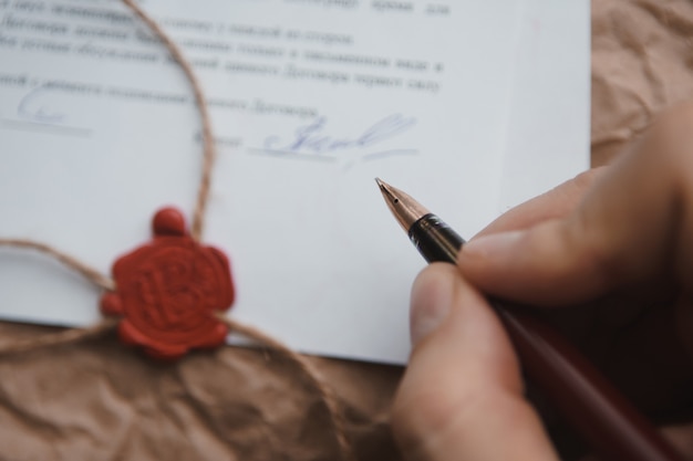A close-up of official documents being verified, perhaps birth certificates and marriage licenses, emphasizing the importance of document authentication in dependent eligibility verification.