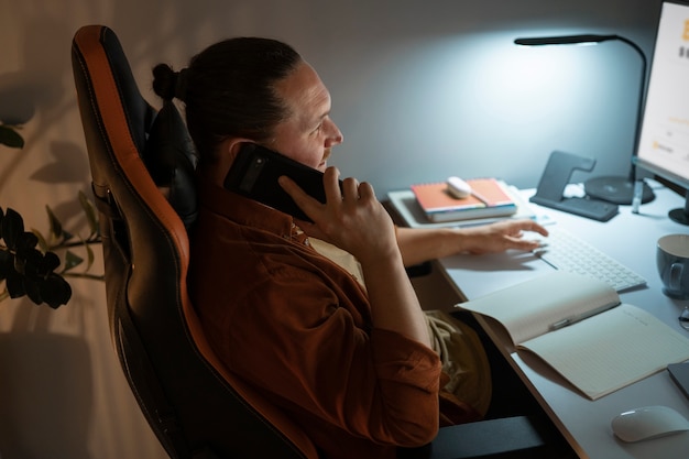 A person working from a home office with ergonomic setup, including a comfortable chair, a monitor, and good lighting, highlighting the importance of well-being in a remote work environment.