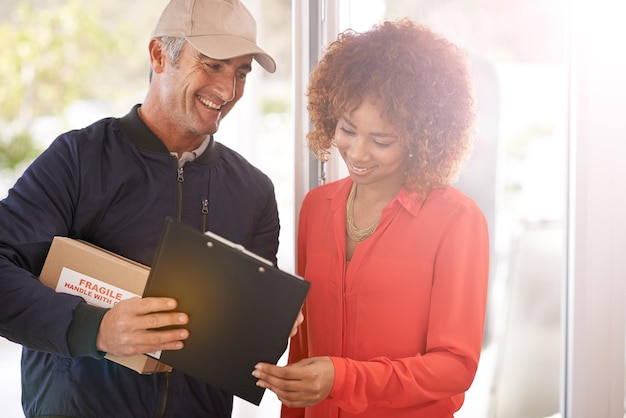 An HR professional smiles reassuringly while discussing updated benefits packages with an employee in a bright, modern office. The scene underscores positive communication and support in navigating benefits adjustments during inflation.
