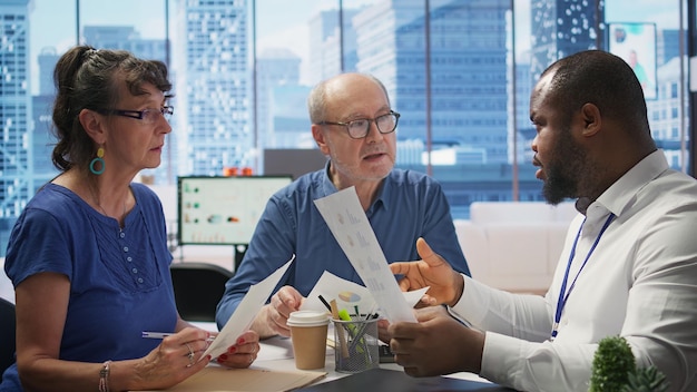 A diverse group of people attending a financial planning seminar, focusing on healthcare savings strategies.