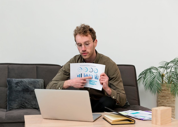 A person analyzing financial reports on a laptop, suggesting careful management of inherited wealth through informed investment decisions.