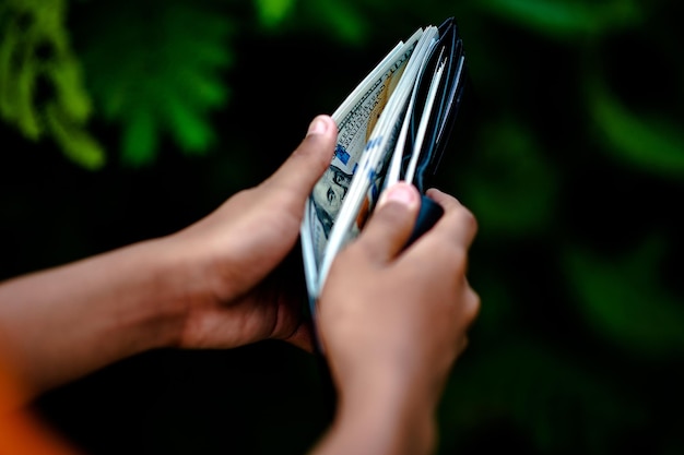 A person depositing money into a savings account through a mobile banking app on a smartphone. The image highlights the convenience of digital banking and saving.