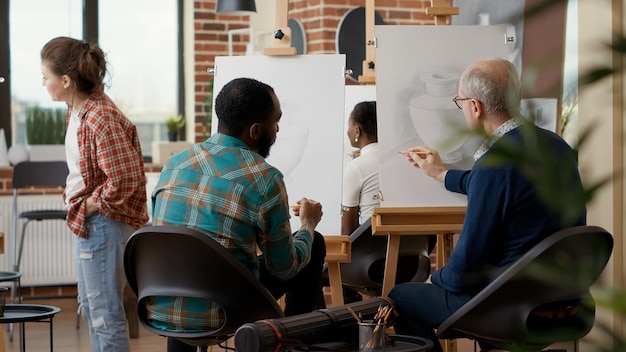 A group of teachers participating in a professional development workshop. They are engaged in a hands-on activity, discussing and sharing ideas, with a facilitator guiding the session.